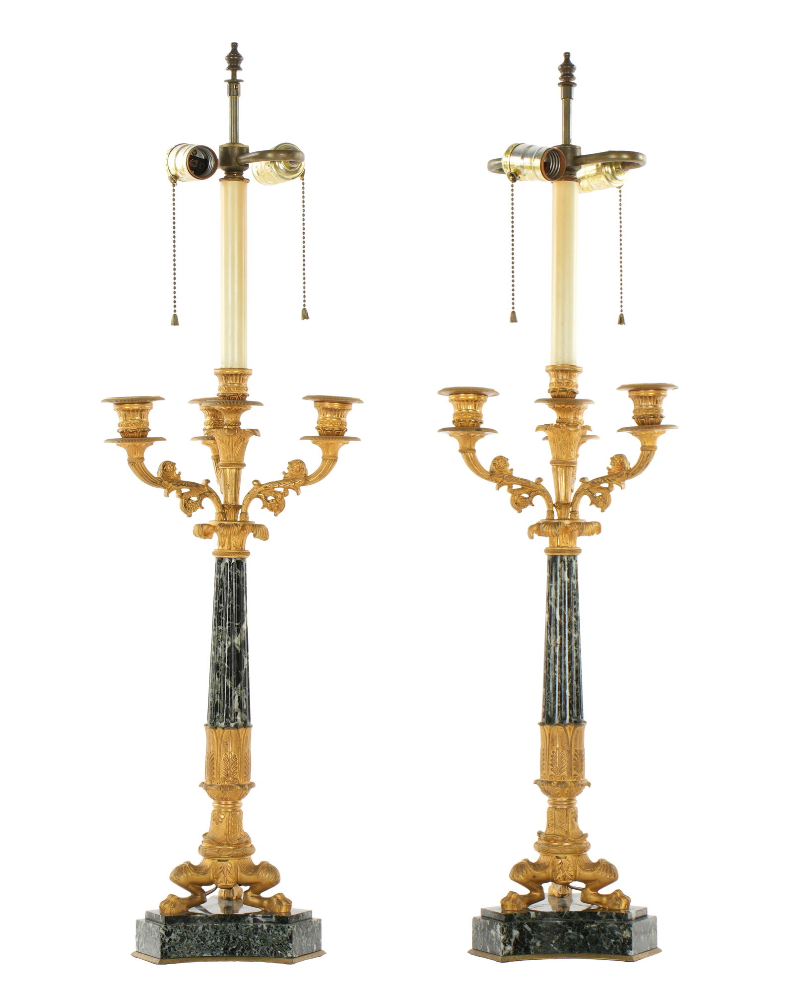 Pair French Gilt Bronze & Marble Candelabra Lamps: Gilt bronze three scroll candle arms of fluted tapered marble columns shafts supported by three gilt bronze paw feet. All on splayed marble base. Double socket light fixture extends from center bobech