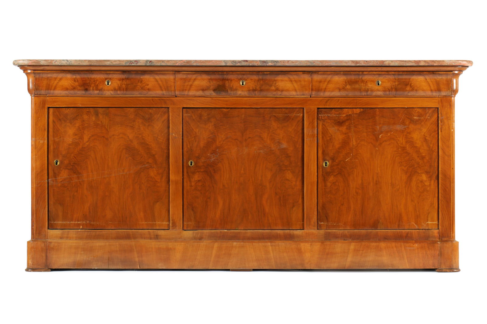 19th Century French Marble Top Sideboard / Buffet: Variegated salmon pink marble top with rounded front corners. Mahogany case with three drawers over three doors, all on four feet. Overall 36.75" h. x 80" x 19.5". Condition: Top with scratches and we