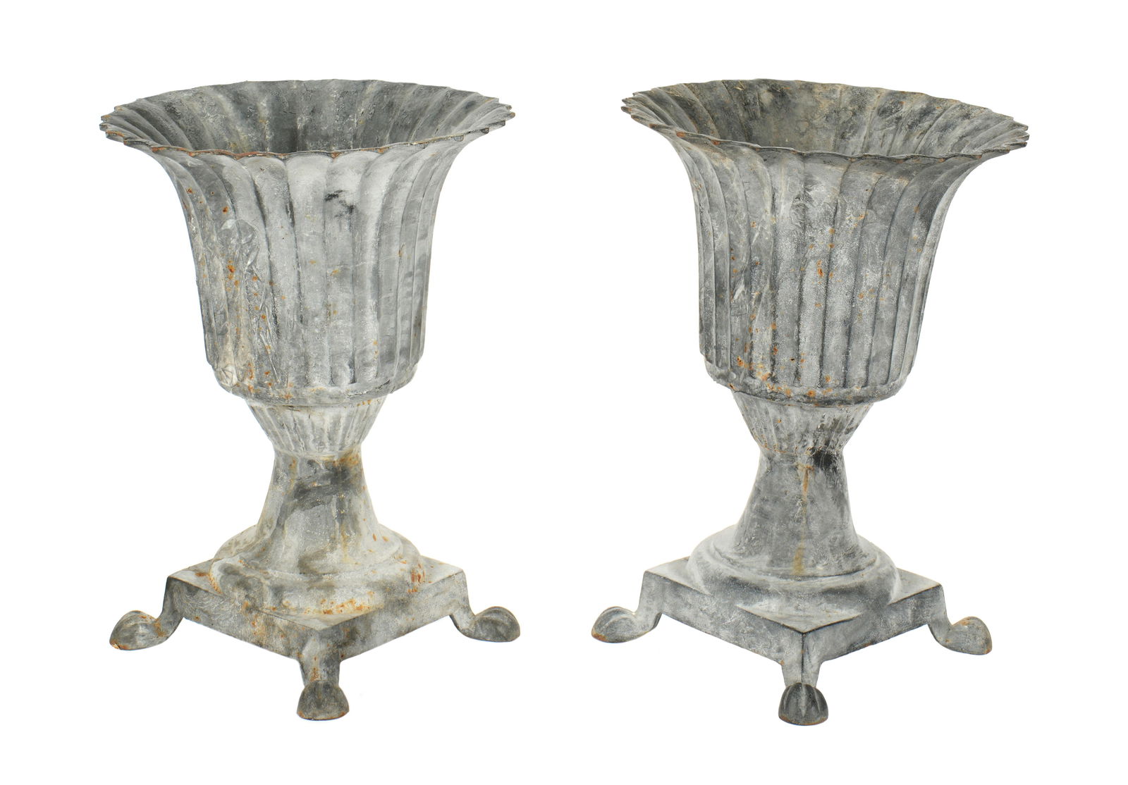 Pair French Cast Iron Fluted Urn Garden Planters: 20th Century. Painted cast iron, fluted urn planters, square base, all on for paw feet. Overall 23.25" h. x 17.25". Condition: Obvious signs of weathering. Shippers note: Approx. 50 lbs a piece.