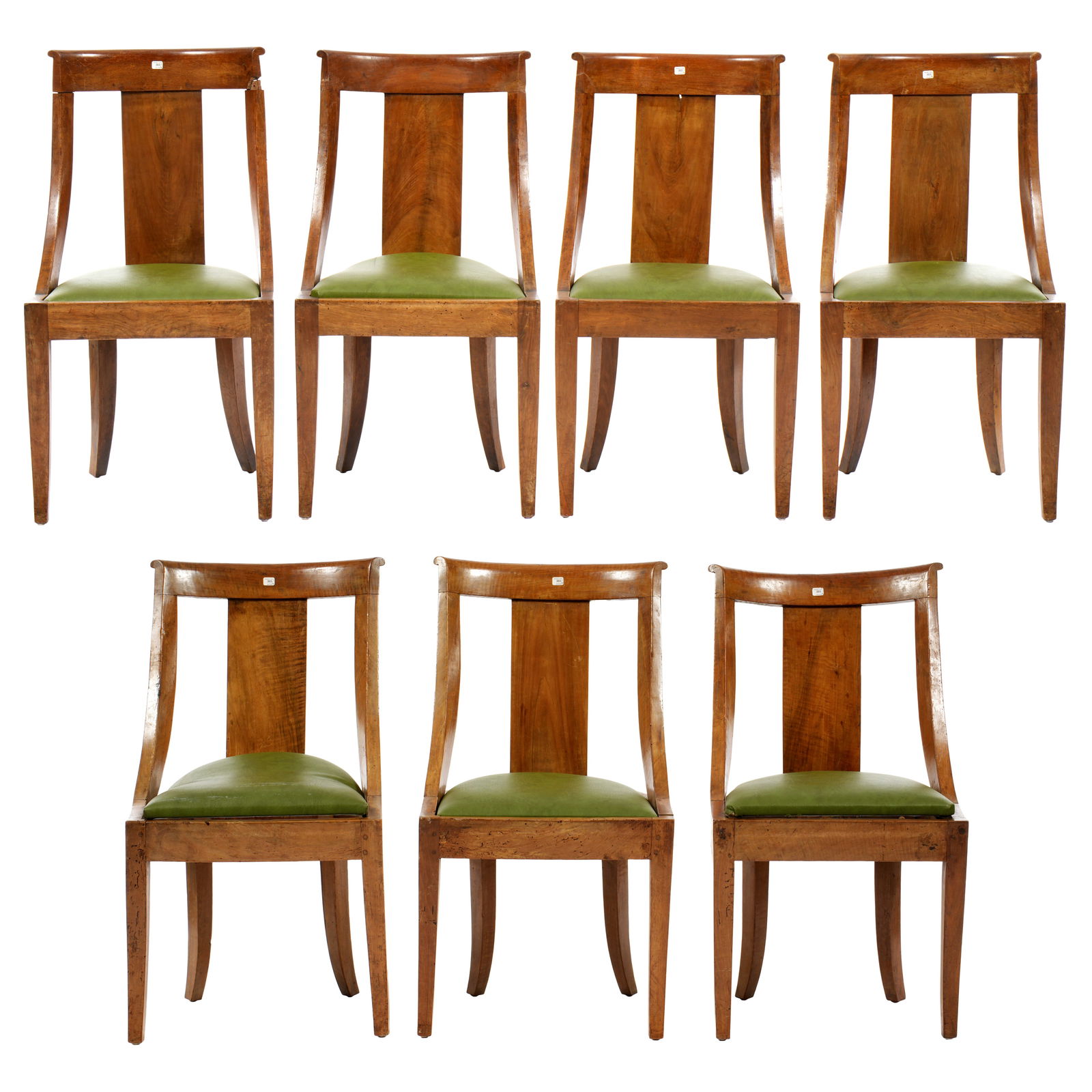 Seven French Empire Walnut Gondola Side Chairs: Set of seven "Gondola" chairs, shaped walnut frames, mottled green leather cushions. Bears 2013 Beaussant Lefevre auction tags. Each 34" h. x 18.25" x 18". Condition: Multiple repairs, scratches, ding