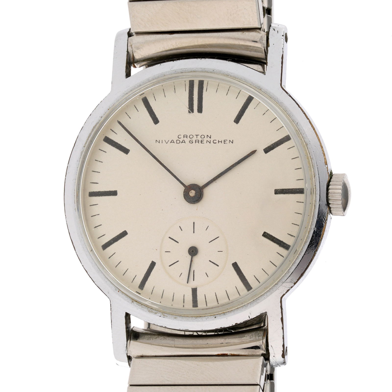 Vintage Croton Nivada Grenchen Wrist Watch: 30mm stainless steel case, manual wind movement, white dial with black markers, subsidiary second dial, stretch link bracelet. Condition: Scratch to crystal, other minor signs of wear. Currently runni