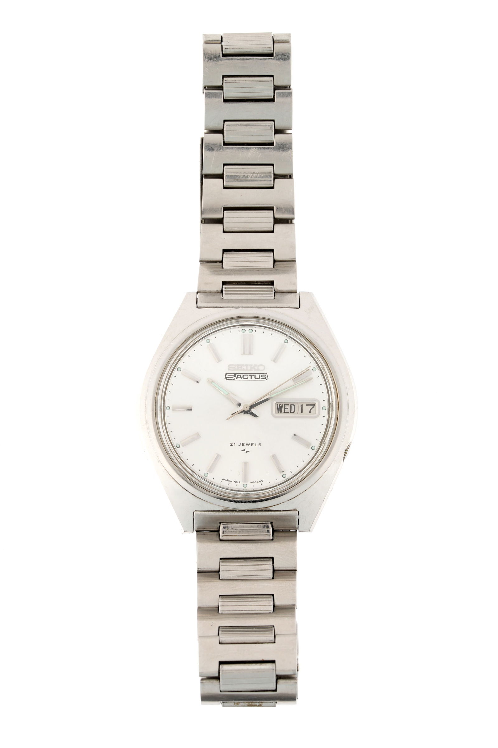 Vintage Seiko 5 Actus Stainless Wrist Watch: 38mm stainless steel case, automatic movement, model 7019-8010, silvered dial, subsidiary day/date dials, sterling silver link bracelet, approx. 7". Condition: Minor signs of wear and use.