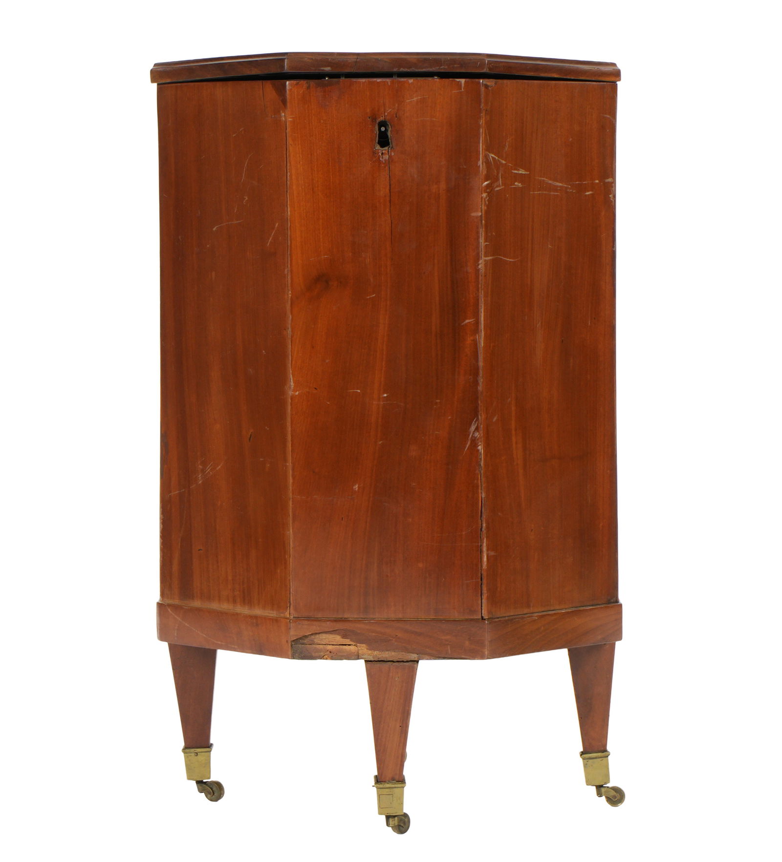 Victorian English Octagonal Mahogany Cellarette: Octagonal mahogany case, hinged lift top, brass handles, on four tapered legs ending in brass castors. Overall 29" h. x 18". Condition: Scratches, veneer chips and wear. Please see photos.