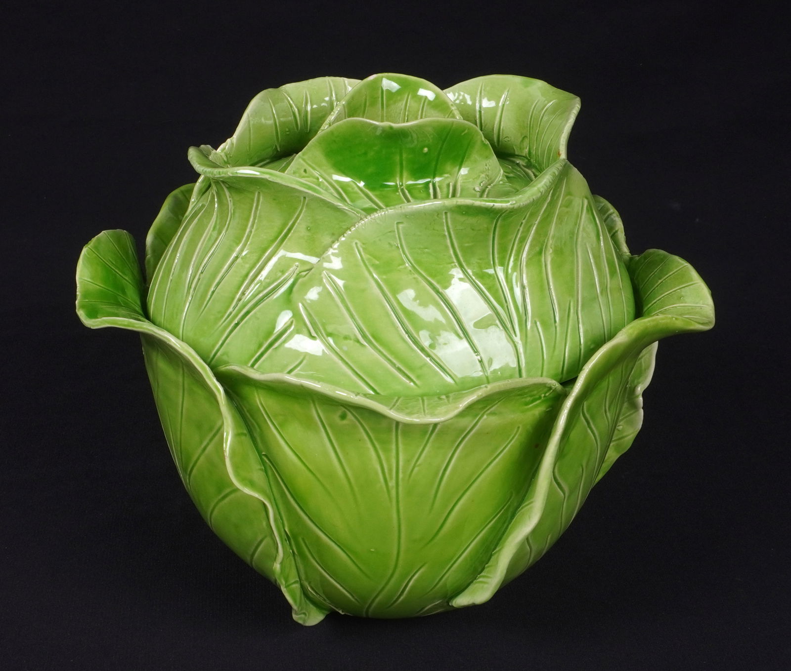 Jean Roger Paris Ceramic Cabbage Tureen: Green cabbage form ceramic tureen, signed under lid Jean Roger, Paris, Made in France. Marked under base Made in France. Overall 7.5" h. x 9" dia. Condition: Chip to one leaf near base.