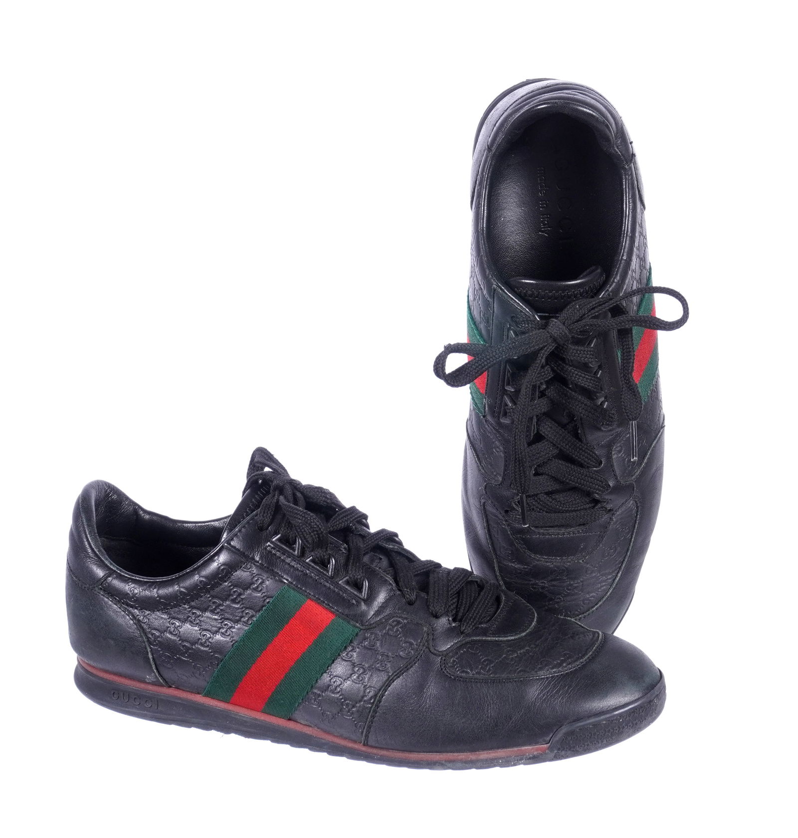 Pair Gucci Mens Guccissima Leather Web Sneakers: Pair mens Guccissima black leather sneakers, embossed black leather, green and red canvas stripes, logo soles. Size 8G (approx. 41 Euro). Sold with a Gucci shoe box and cloth dust bag. Box measures 5.