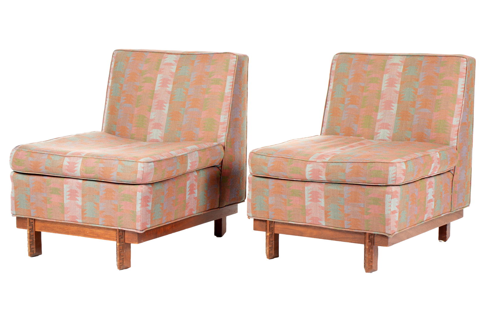 Pair Frank Lloyd Wright Henredon Slipper Chairs: Pair Taliesin armless slipper / side chairs designed by Frank Lloyd Wright for Heritage Henredon, Mahogany wood base with carved trim. Original geometric Southwest pattern upholstery. Original manufac