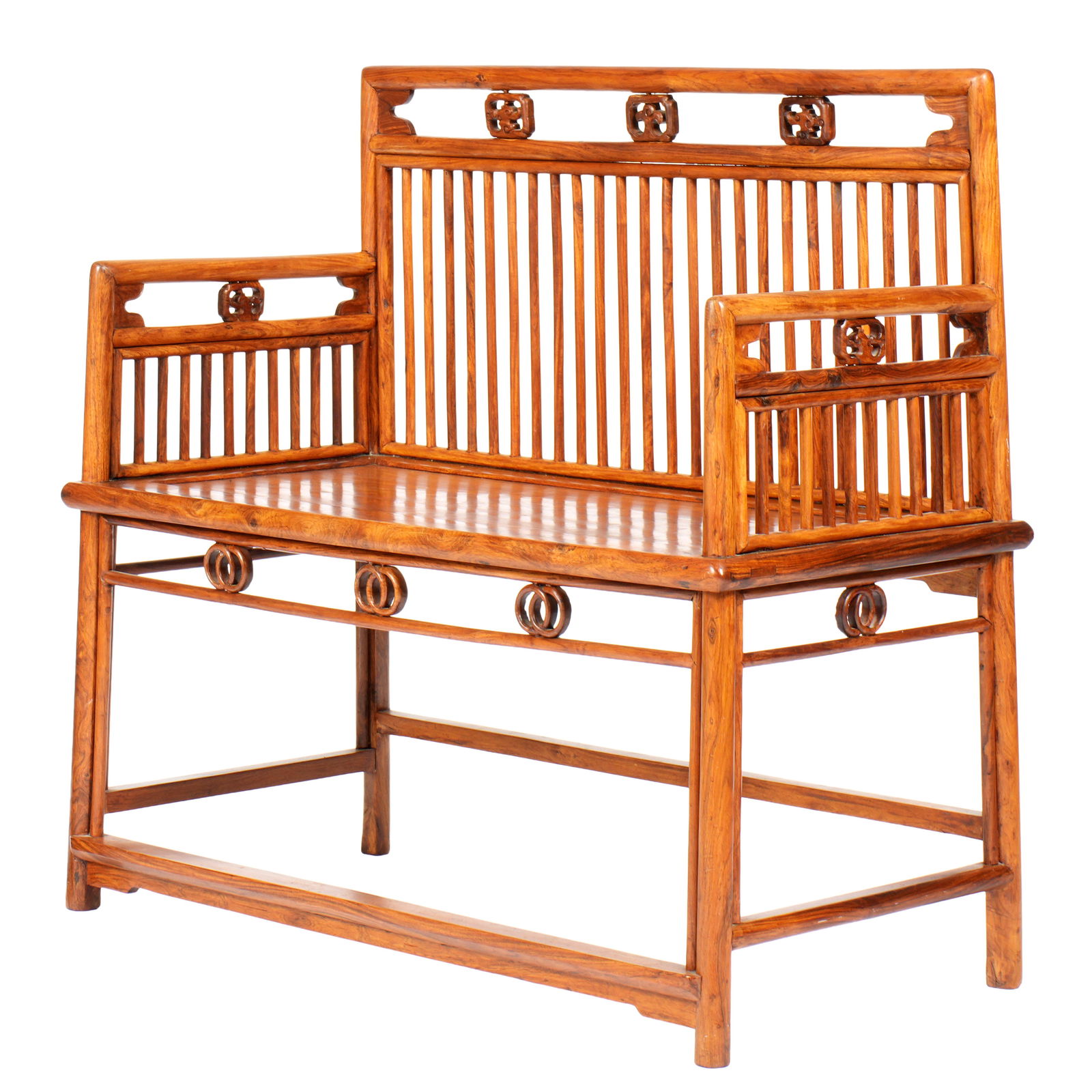 Chinese Huanghuali Settle Bench: 20th Century Chinese Huanghuali or similar wood settle bench. Turned top rail and arms over reticulated pierced carved medallion accents. Turned stick back and arm supports. Skirt with reticulated con