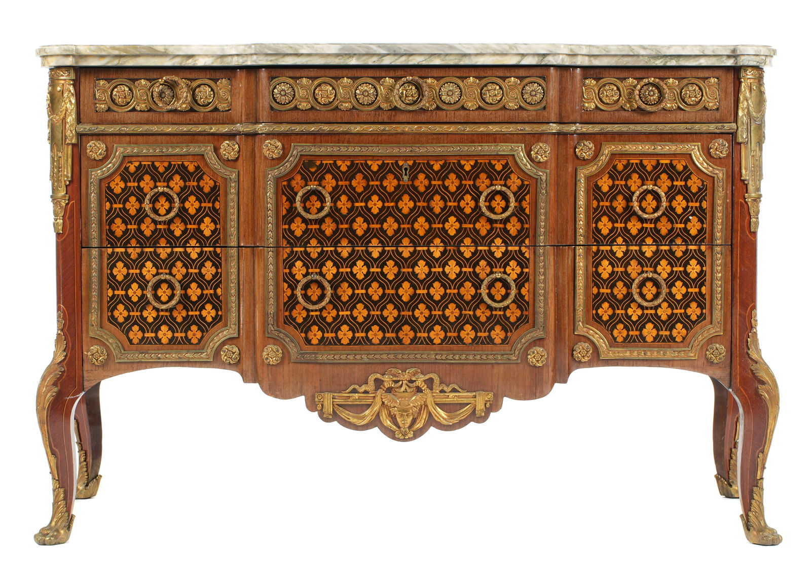 French Louis XVI Style Inlaid Marble Top Commode: Variegated shaped marble top over conforming tow floral marquetry inlaid drawers and sides. Gilt bronze ormolu mounts, decorations and accent panels. Shaped skirt, on four cabriole legs. Overall 34.75