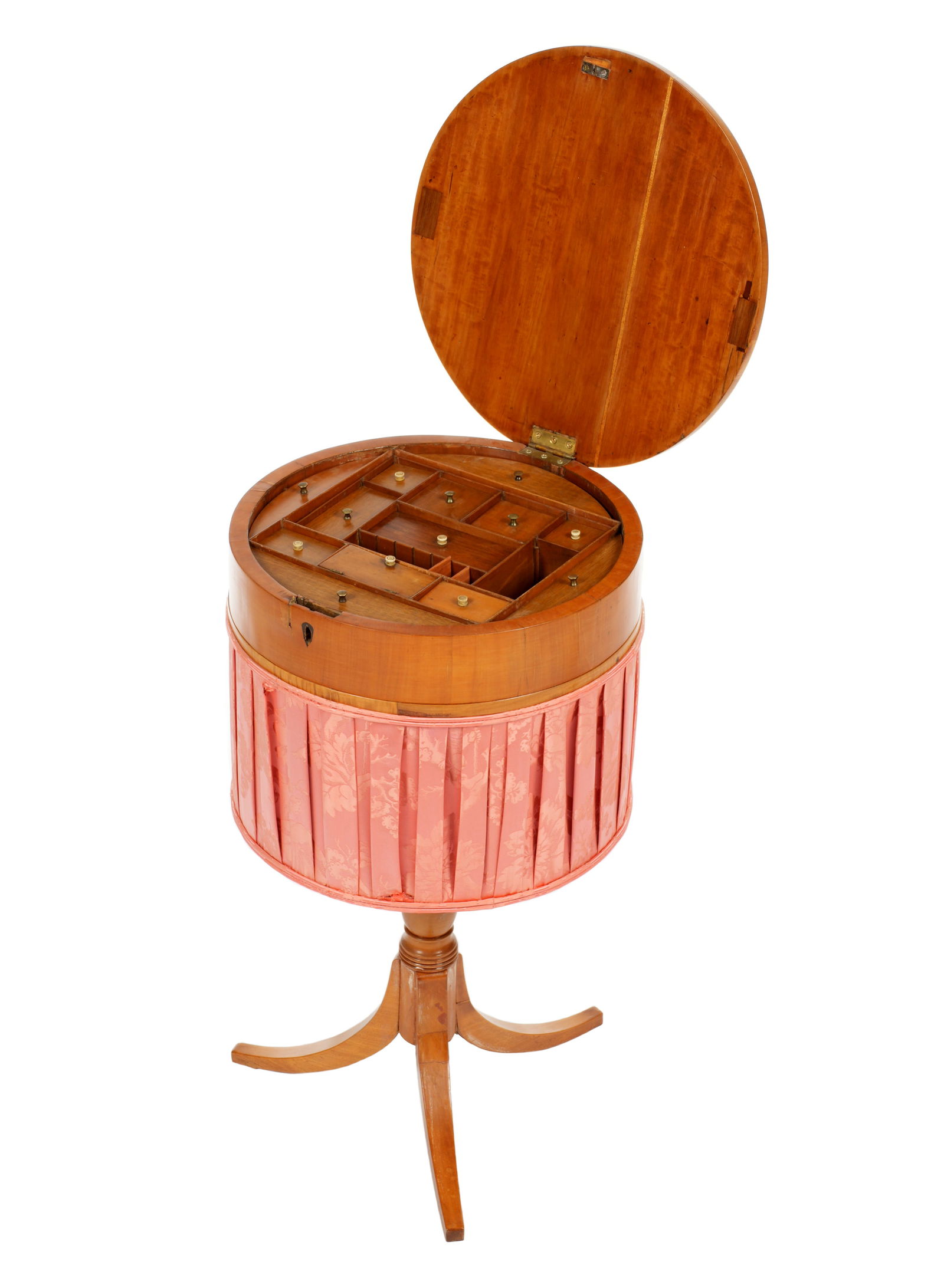 Victorian Sewing Stand / Work Table: 19th Century hinged banded round top opens to fitted interior with lidded and open compartments. Pleated patterned salmon pink skirt, turned column support, three splayed legs. Overall 28.25" h. x 15.