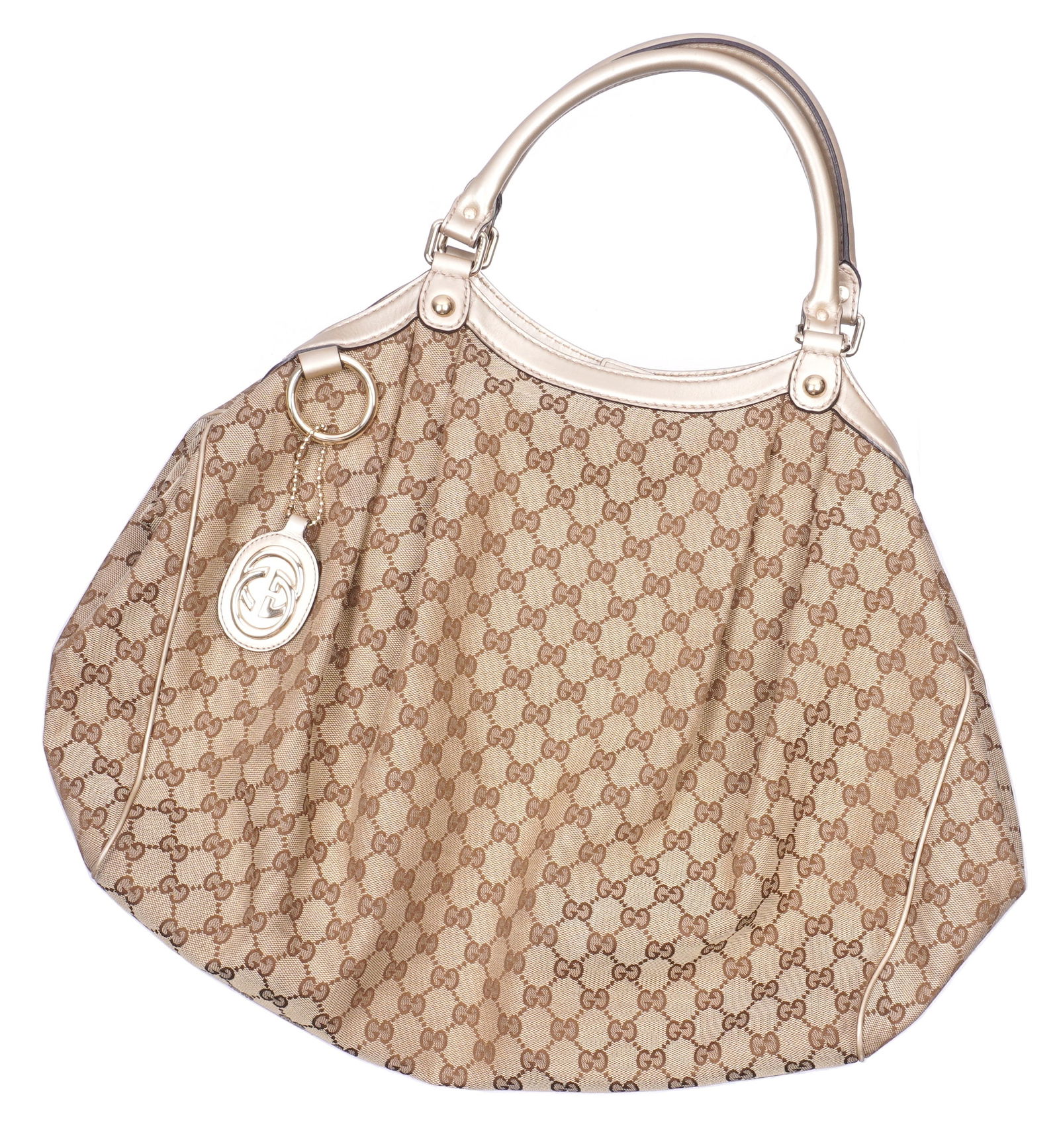 Gucci Sukey Monogram Canvas & Leather Tote Bag: "Sukey" monogram brown canvas tote / hand bag by Gucci. Silver leather accents and handles, chrome ring. Overall 53cm h. including handles x 43cm x 12cm (19.5" x 17" x 4"). Condition: Minor signs of w