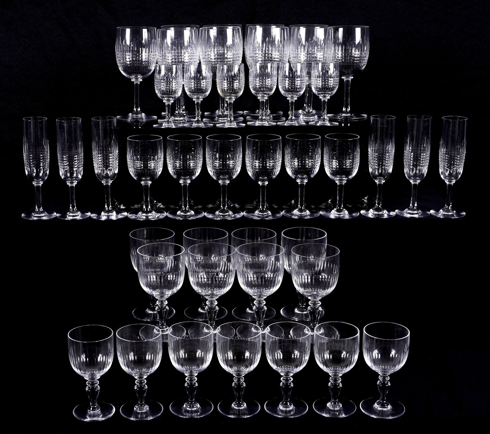 42 Piece Baccarat Nancy & Renaissance Stemware: An assembled collection of 43 pieces total by Baccarat Crystal. "Nancy" pattern to include 10 tall water goblets (6.75"), 6 claret wine (5.5"), 6 sherry (4.25"). "Renaissance" pattern to include 8 wat