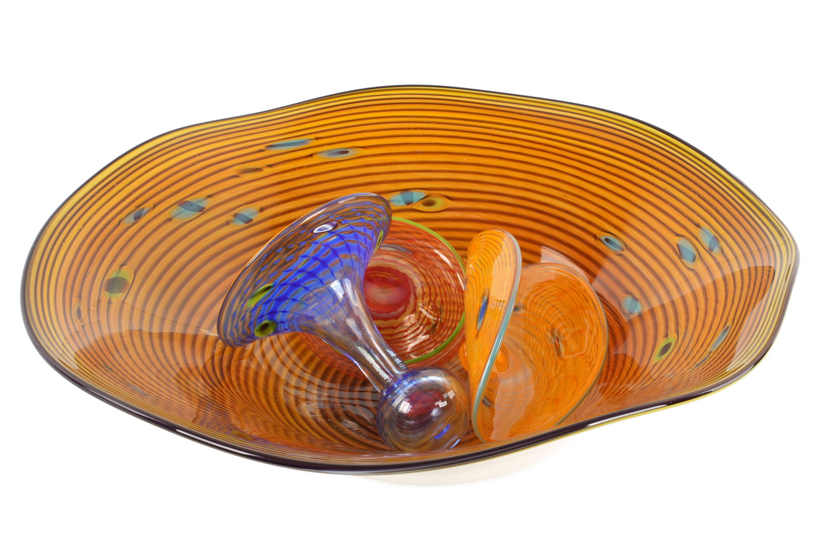 Four Piece American Art Glass: Four piece collection of hand blown art glass bowls and vessels. Largest piece illegibly signed Jim Stark? and dated 2003. Largest bowl measures 3.5" h. x 1212.5". Condition: An additional loose swirl