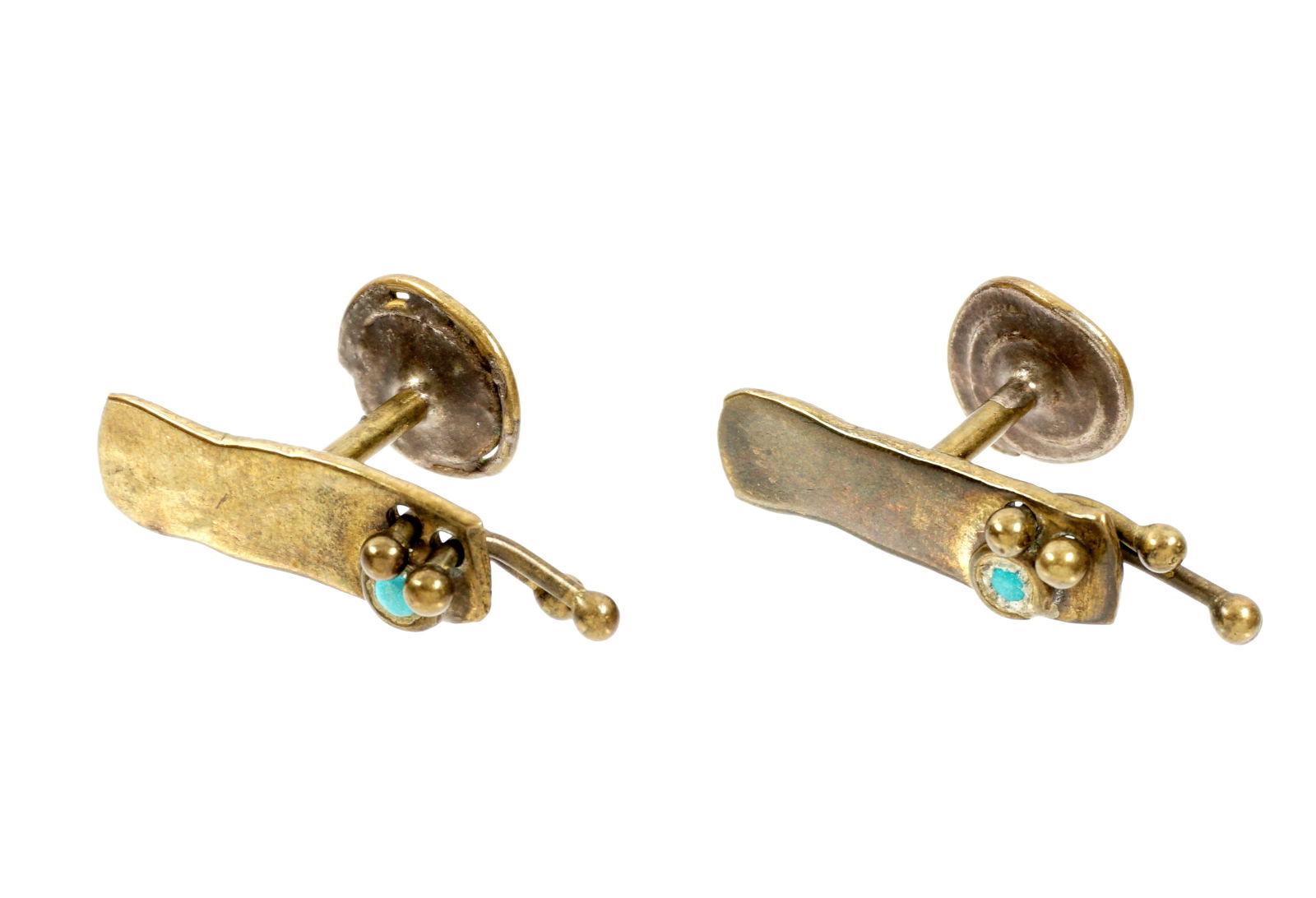 Pair Claire Falkenstein Cufflinks: Pair modernist brass cufflinks, inset blue stones, unmarked,. 1 1/8" x .5".
