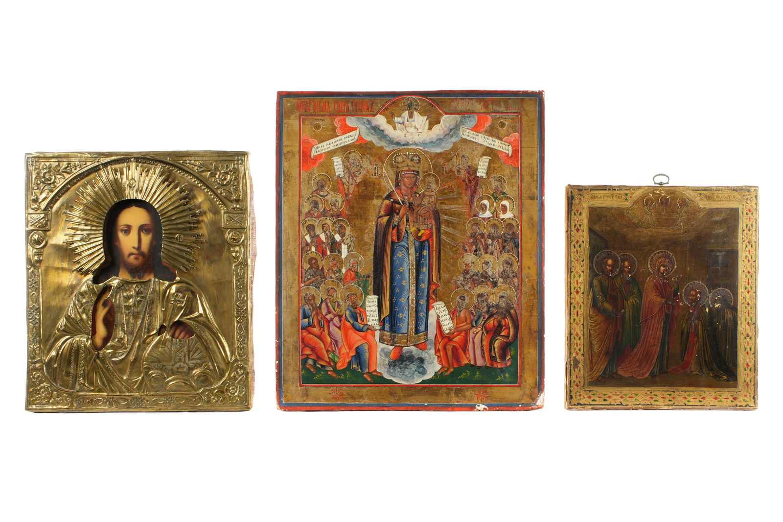 Three Early Russian Icons: An assembled collection of three Russian icons to include 1) Depiction of the Mother of God appearing to St. Sergius, on wood panel, 12.25" x 10.5". 2) Christ Pantocrator under embossed brass oklad, 1
