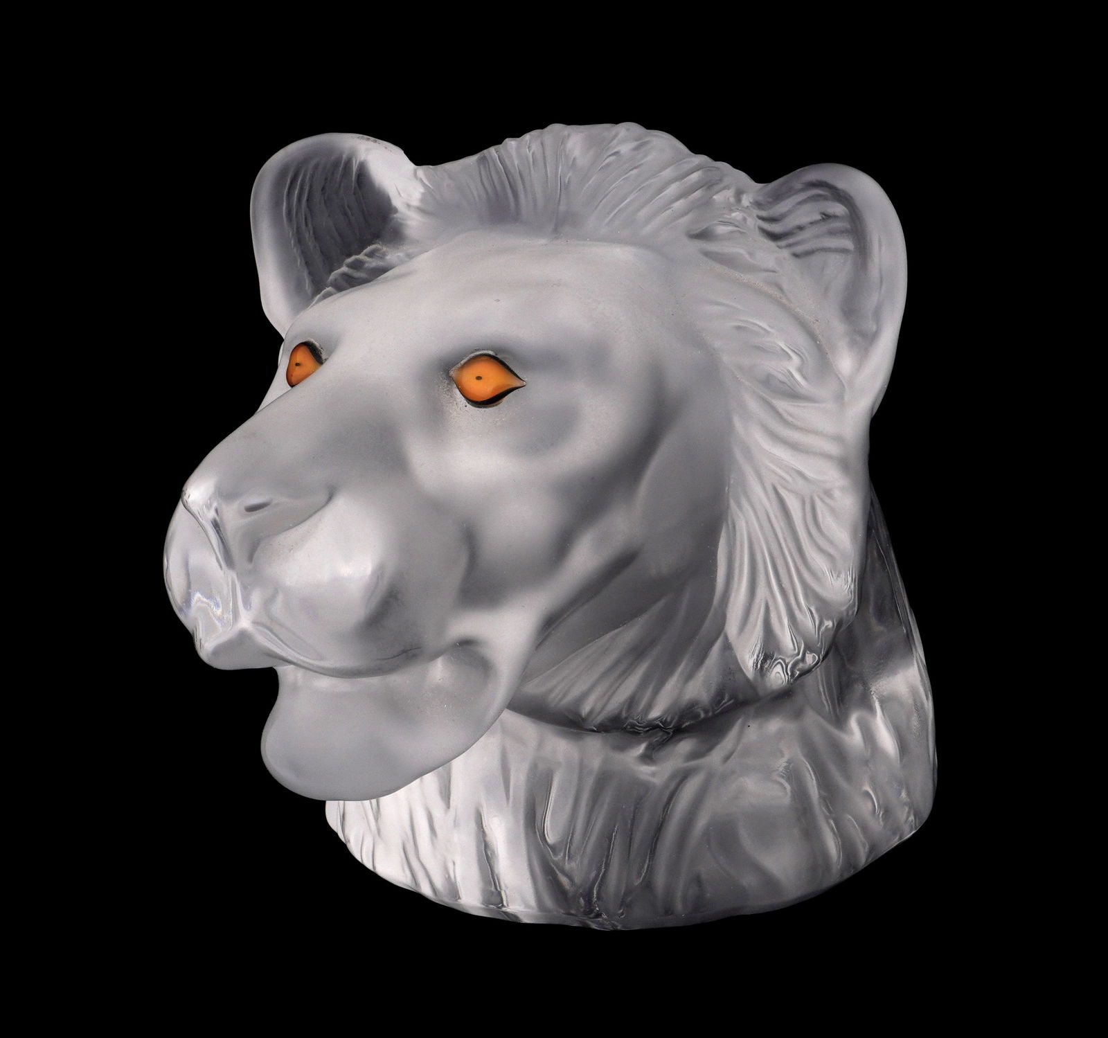 Saint Louis French Crystal Lion Hand Paperweight: Molded and frosted crystal figural lion head with colored glass eyes. Signed on base. Overall 3.75" h. x 4" x 4.75". Condition: Minor scratches to base.