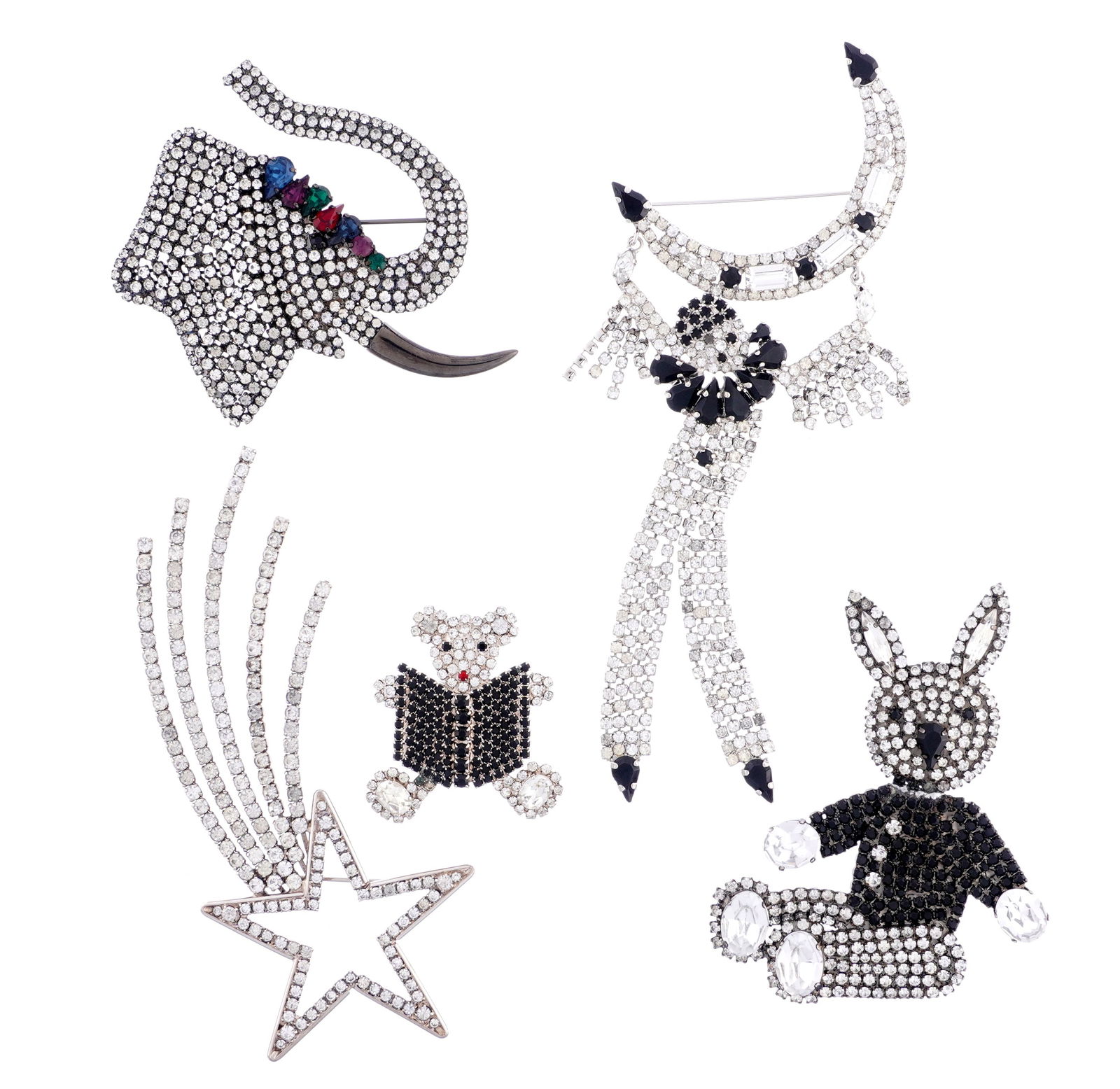 Five Pieces Butler & Wilson Costume Jewelry: Five piece silver metal and rhinestone brooches to include shooting star, clown hanging from the moon, bear, rabbit, and elephant. All signed. Largest 6.25" long. Sold with several boxes and pamphlet.