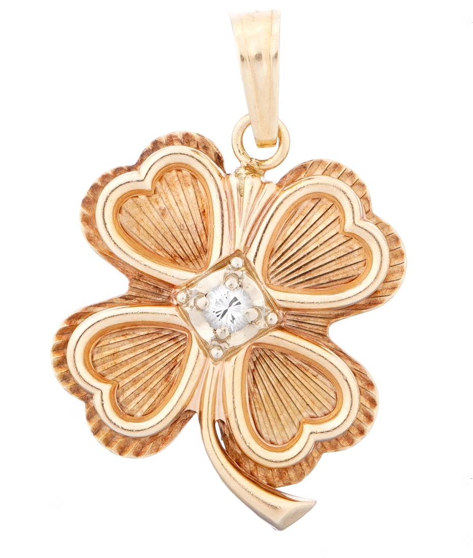 14k Gold & Diamond Four Leaf Clover Pendant: Clover leaf form 14k yellow gold pendant, center prong set round diamond, approx. .12 ct. Marked 14k, 1.5" h. Approx. 7 grams inclusive.