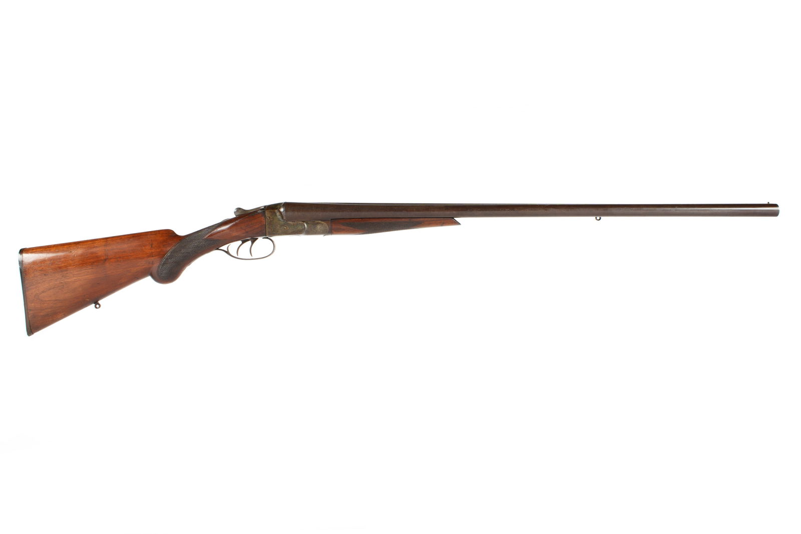 Baltimore Arms 12 Gauge Double Barrel Shotgun: Serial number A 2601, hammerless side by side, Damascus barrel length 30", 14" length to pull, checkered walnut stock, overall 46.25" long. Condition: Minor spotting to barrel exteriors, scratches to