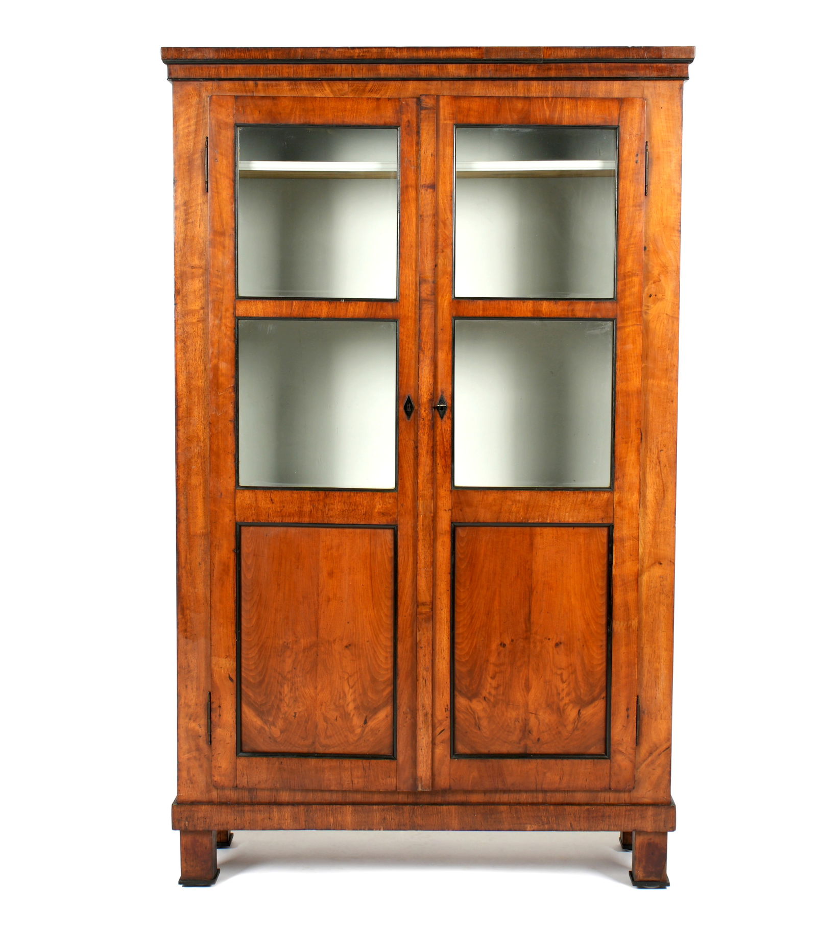 19th Century French Walnut Bookcase / Cabinet: Two door French walnut bookcase / display cabinet, Four glass windows over two blind panels. White painted interior with four shelves, on four feet. Overall 71" h. x 42" x 14.75". Wear consistent with