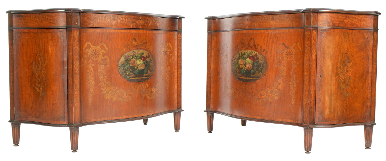 Pair Inlaid English Hepplewhite Demilune Cabinets: Marquetry inlaid all over with flowers, urns, foliate swags, and bows. Fronts with painted floral motif center medallions. Single front doors, shaped side doors. Overall 36.75" h. x 53" x 24".