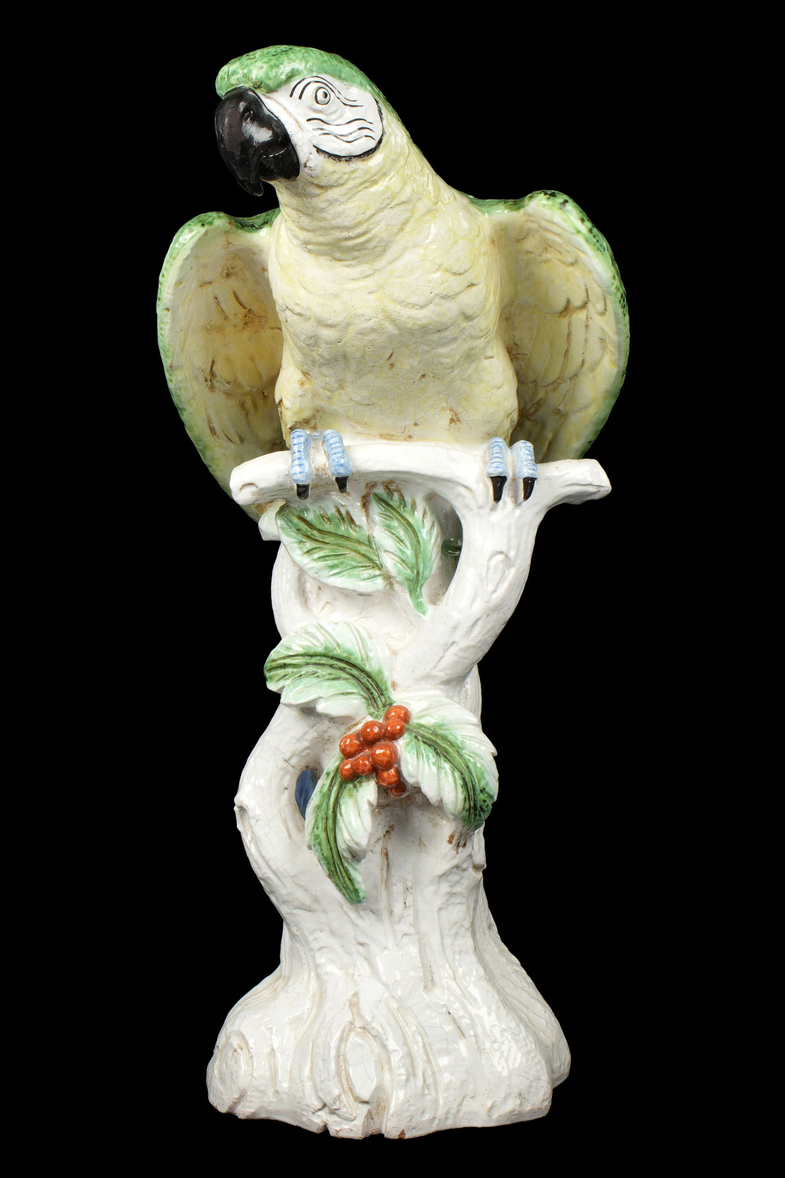 Large Italian Majolica Ceramic Parrot: Polychrome glaze ceramic figure of a parrot perched on a stump, marked "Italy for Meiselman Imports". Overall 30" h. x 12.5" x 15". Condition: Crazing.