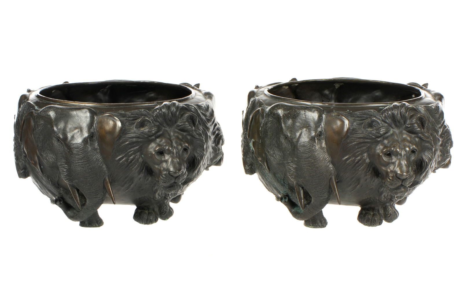 Pair Genryusai Seiya Japanese Bronze Jardinieres: Pair Meiji period patinated bronze jardinieres / planters, high relief masks of elephant, lions, monkey, deer, bull, and boar. All on four feet. Both bear dai Nihon Genryusai Seiya zo" impressed seal