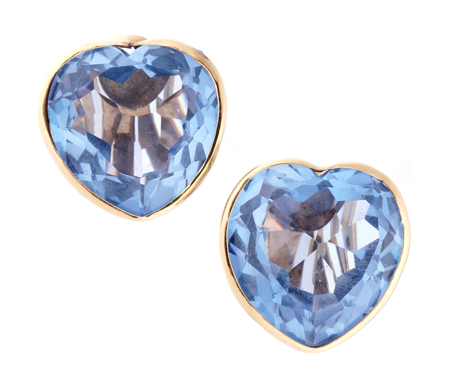 Pair 14k Gold & Heart Blue Topaz Earring by Josie: 14k yellow gold clip earring, faceted heart shaped blue topaz, each approx. 20mm x 20mm. Approx. 154.6 grams inclusive.