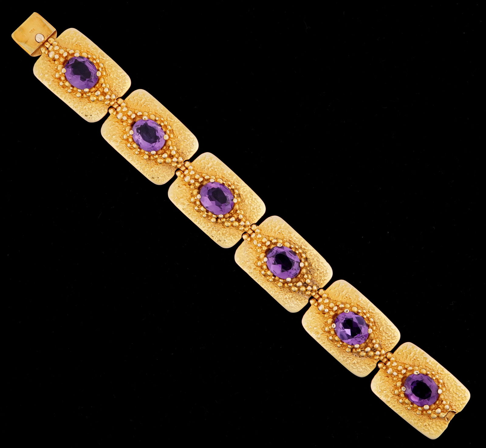 Brutalist 14k Gold & Amethyst 6 Link Bracelet: Brutalist inspired 14k yellow gold links, 6 links with prong set faceted oval amethyst, each approx. 12 mm x 10mm. 7.5" long. Approx. 76.6 grams inclusive.