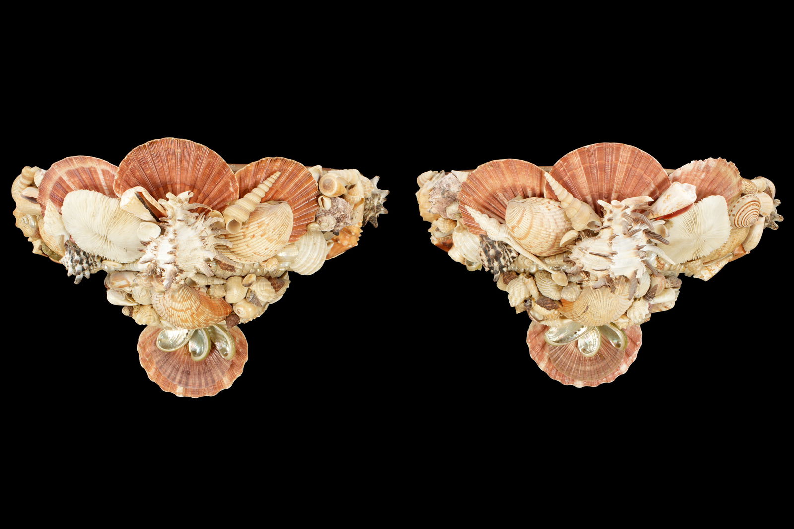 Pair Seashell Encrusted Wall Sconces: Pair pottery wall sconces, encrusted all over with applied seashells. Single socket fixtures, overall 9" h. x 13.75" x 8".