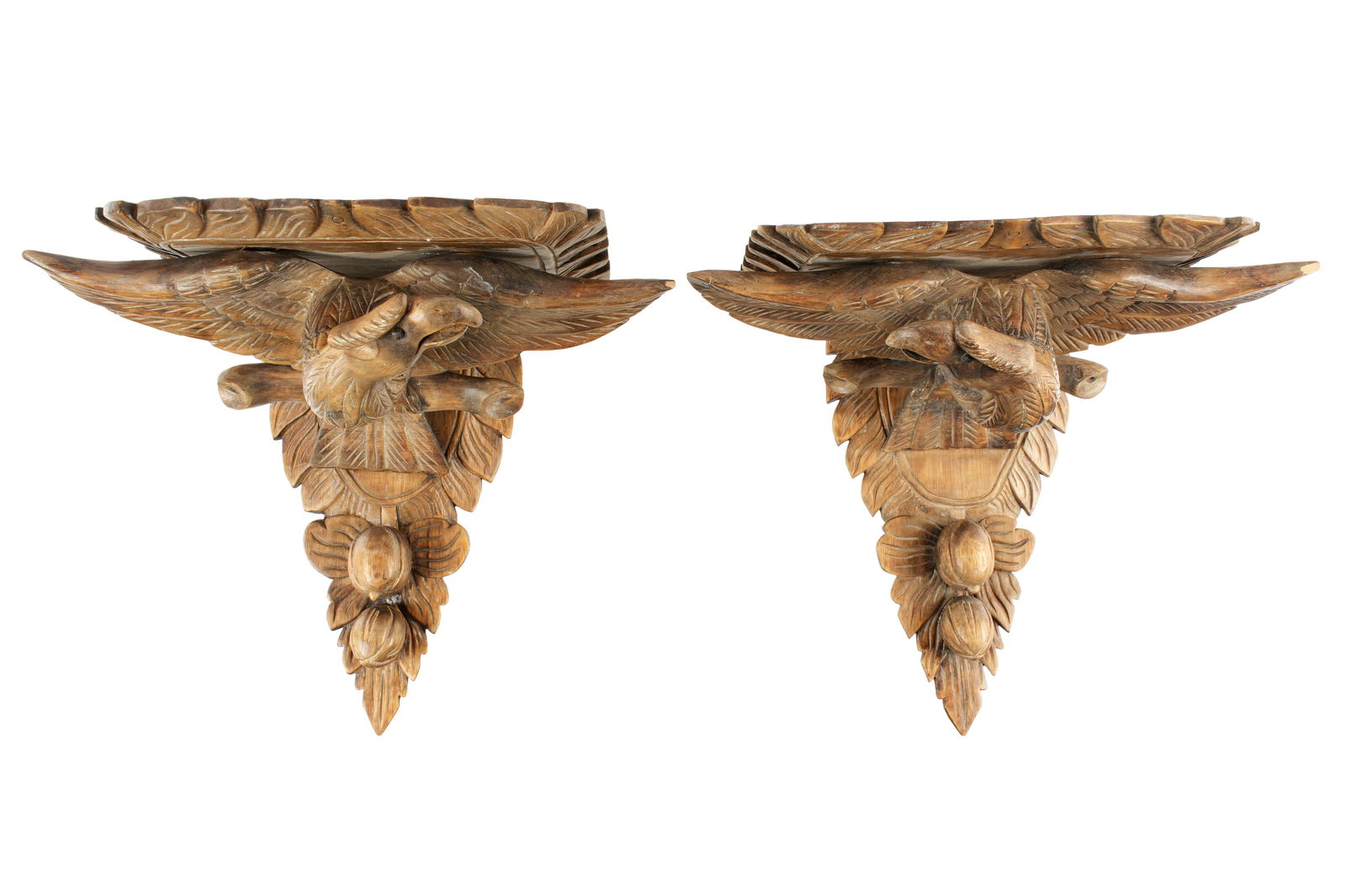 Pair Chippendale Style Eagle Wall Brackets: 20th Century, carved figural perched spread wing eagles over fruit, overall 17" h. x 20" x 12". Condition: Several minor chips.