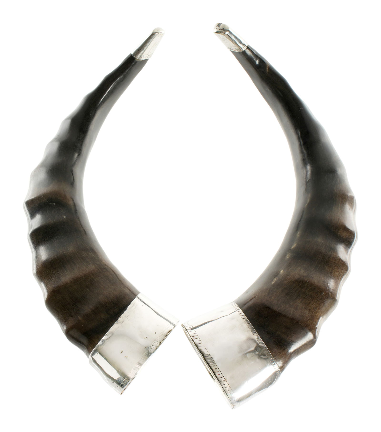 Pair Continental Silver Mounted Drinking Horns: Silver band at top and tip tests at 98% silver, ruffled horn body, unmarked. Overall 12" long x 7" x 4.75". Condition: Minor dings to silver.