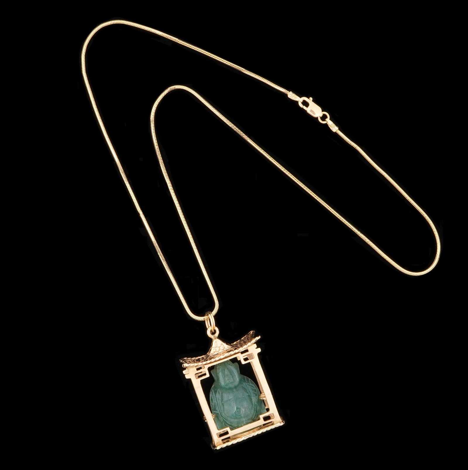 14k Gold Pagoda and Jade Buddha Pendant Necklace: 14k yellow gold pagoda pendant with apple green caved jade or similar stone seated Buddha figure. 14k gold Italian necklace. Pendant 1" h. x .75" x .5". Necklace 15" long. Approx. 18 grams inclusive.