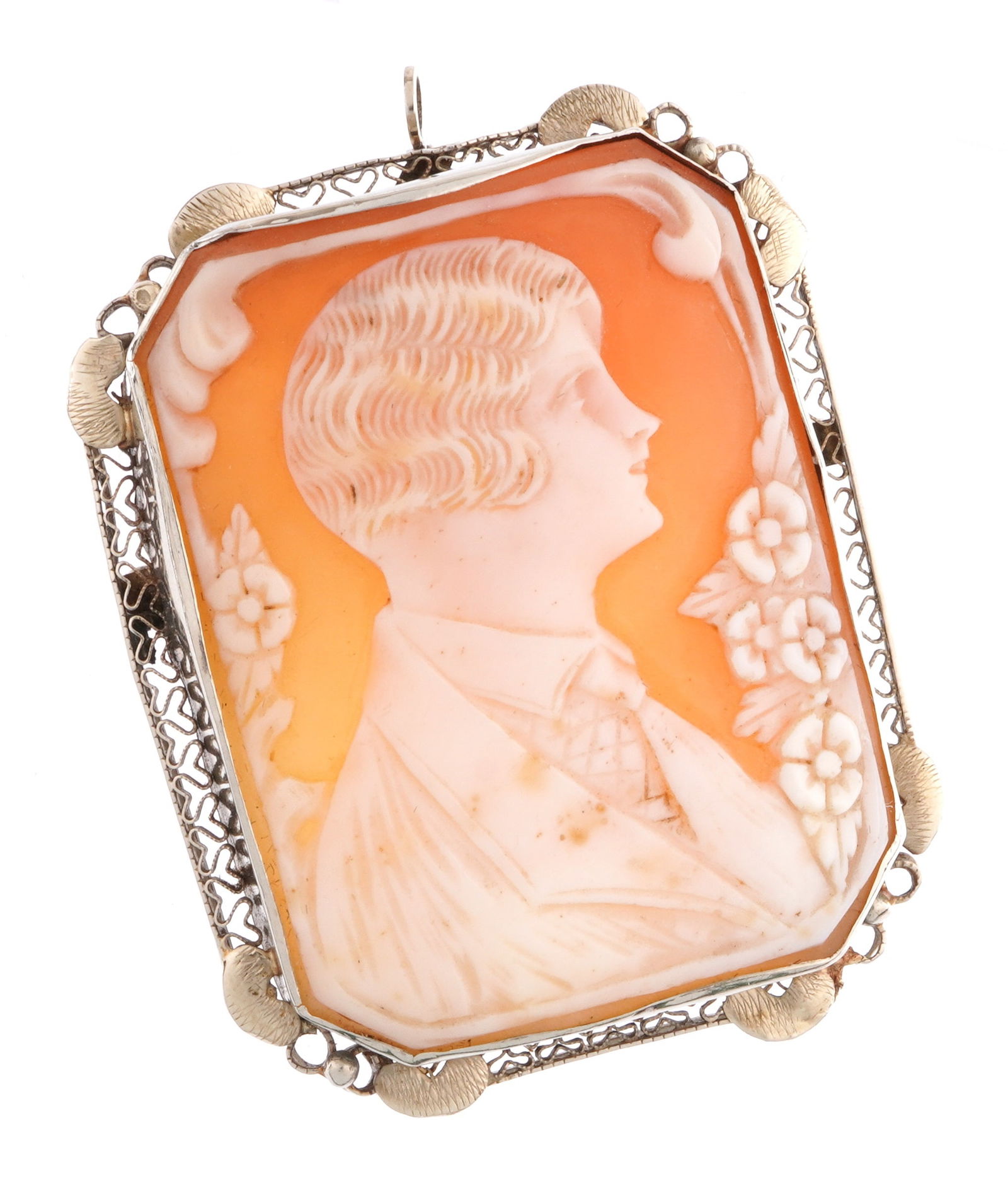 Large Portrait Cameo Brooch stamped 14k.: Profile portrait bust of a young man with tie, floral edges, reticulated filigree frame stamped 14k on clasp. Overall 1.3/4" h. x 1 3/8".