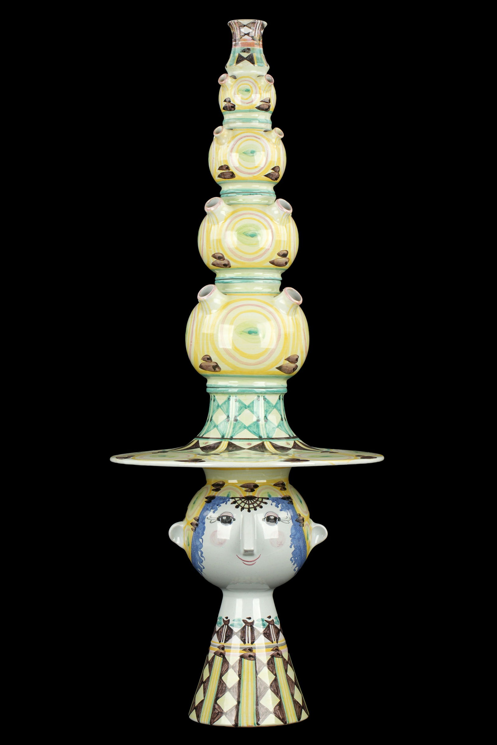 Large Bjorn Wiinblad Denmark Figural Tulipiere: Large five section tulipiere, figural woman's bust with hat, signed on base. Signed under base. Overall 35.5" h. x 1". Condition: Several minor chips and professional repairs.