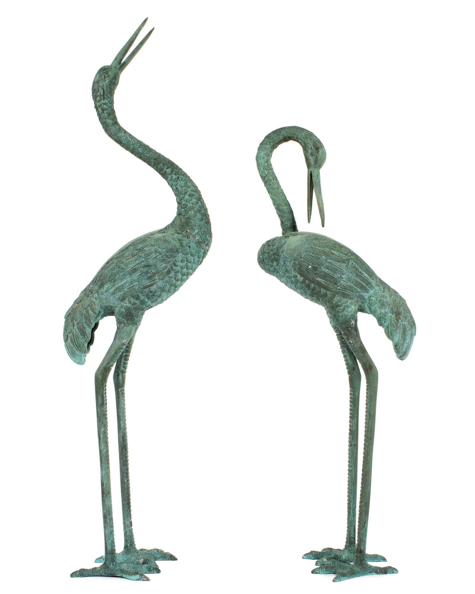 Pair Diminutive Patinated Bronze Garden Cranes: Pair patinated bronze garden crane / stork sculptures, taller measuring 33.5" h. x 5" x 9". Condition: Minor signs of weathering.