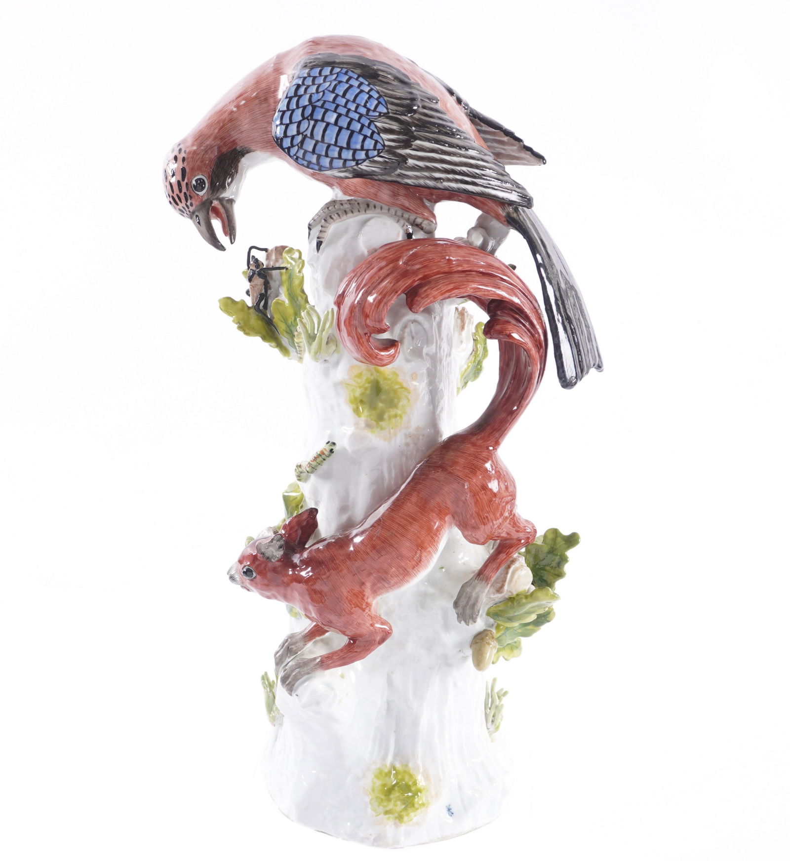 19th Century Meissen Style Jay and Squirrel Figure: Meissen style porcelain and polychrome glazed figure of a jay bird and squirrel on a tree trunk, marked with blue crossed swords mark near base. Overall 15.25" h .x 6.5". Condition: Professional