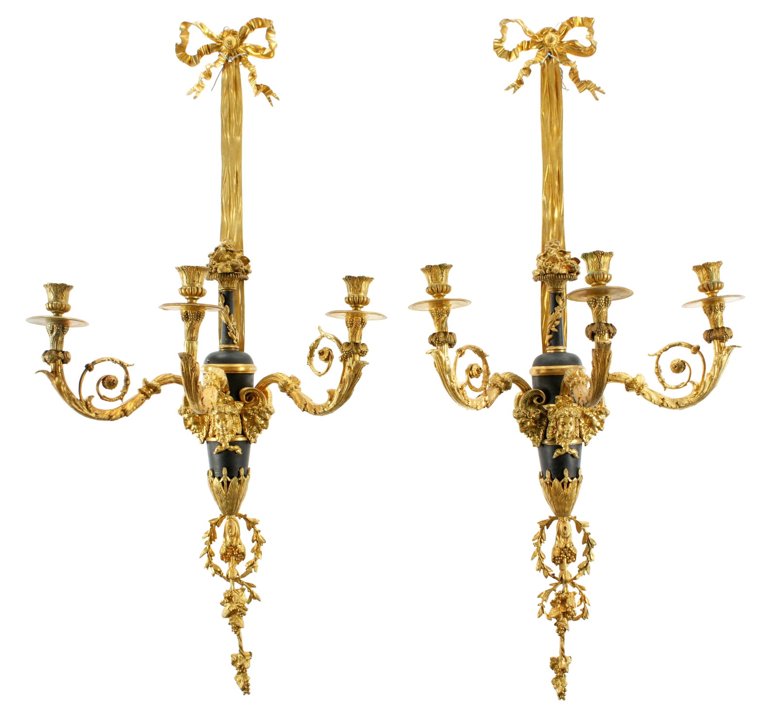 Pr French Parcel Bronze Dore Neoclassical Sconces: 19th Century, gilt bronze bow and ribbon finial over patinated gilt urns, three gilt scroll arms, gilt band with neoclassical maiden and satyr head busts. Lower grape vine finial. Overall 37.25" h. x 