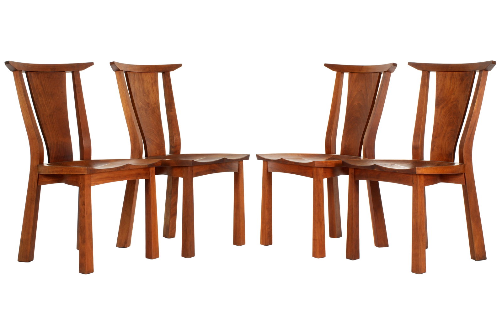 Four Thomas Moser Edo Cherry Side Chairs: Set of four "Edo" dining side chairs by Thomas Moser, shaped black splat and seat, tapered legs. No signature discovered. Overall 35" h. x 20" x 23". Condition: One seat with minor dings, other wear