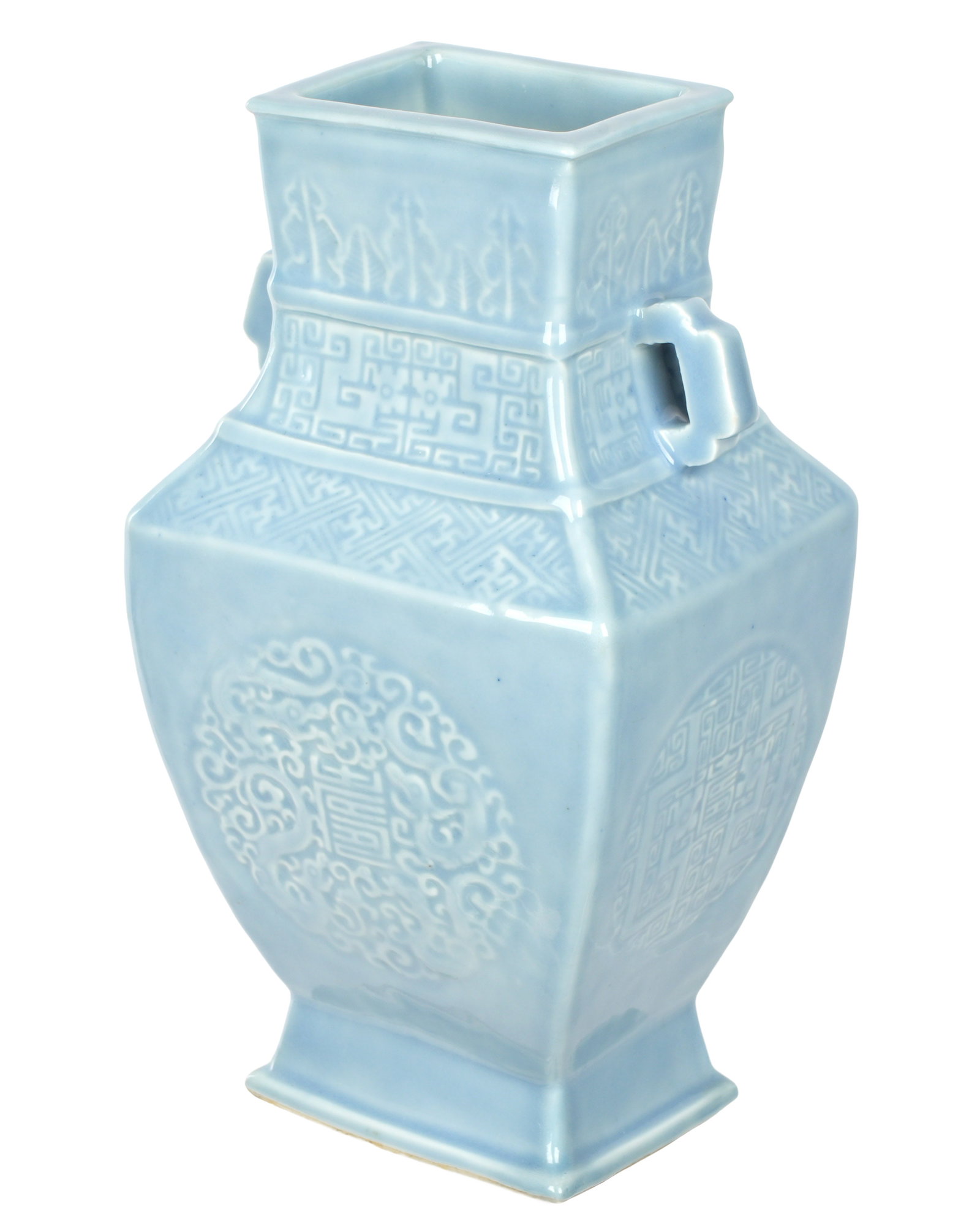 Chinese 18th C. Incised Blue Double Handled Vase: 18th Century porcelain blue glazed vase with incised dragons, fu symbols, geometric designs. Marked on base with drilled Qianlong mark. Overall 10.75" h. x 5.75" x 5".