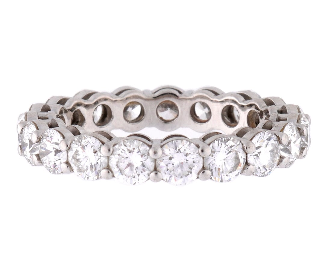 Tiffany & Co. Platinum and Diamond Band Ring: Platinum band with 18 prong set round brilliant cut diamond, D-G in color, Internally Flawless - VS2 clarity, approx. 3.02 ctw. Size 6.5. Approx. 5.4 grams inclusive. Sold with Tiffany retail replacem