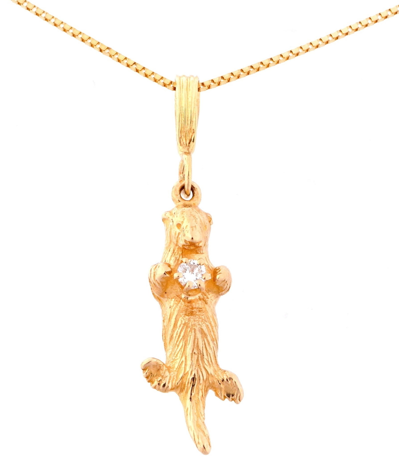 14k Gold and Diamond Otter Pendant Necklace: 14k yellow gold figural otter pendant holding approx. .06ct round diamond, 1.25" long including finding. Italian 14k yellow gold chain, 19.5" long. Approx. 4.2 grams inclusive.