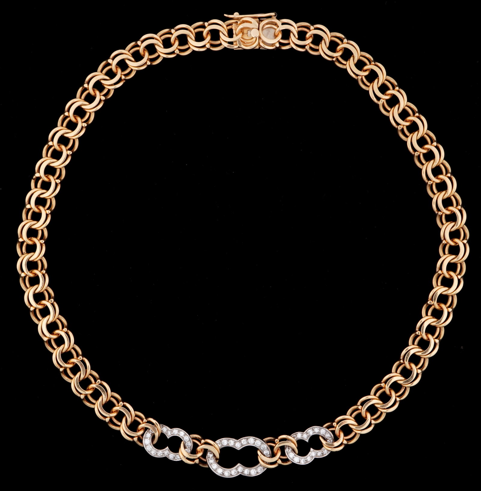 14k Gold and Diamond Chain Link Necklace: Stamped 14k yellow gold chin link necklace, each link with double circles. Three figure "8" white gold links with approx. 61 prong set accent diamonds. Overall 16" long. Approx. 53 grams inclusive.