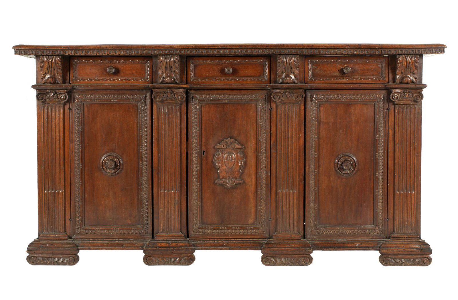 18th Century Italian Carved Walnut Credenza: Rectangular top over conforming case. Three drawers over three doors, applied carved wood accents and pulls. Stiles with acanthus leaf corbels over fluted flat columns, carved front feet. Overall 41" 