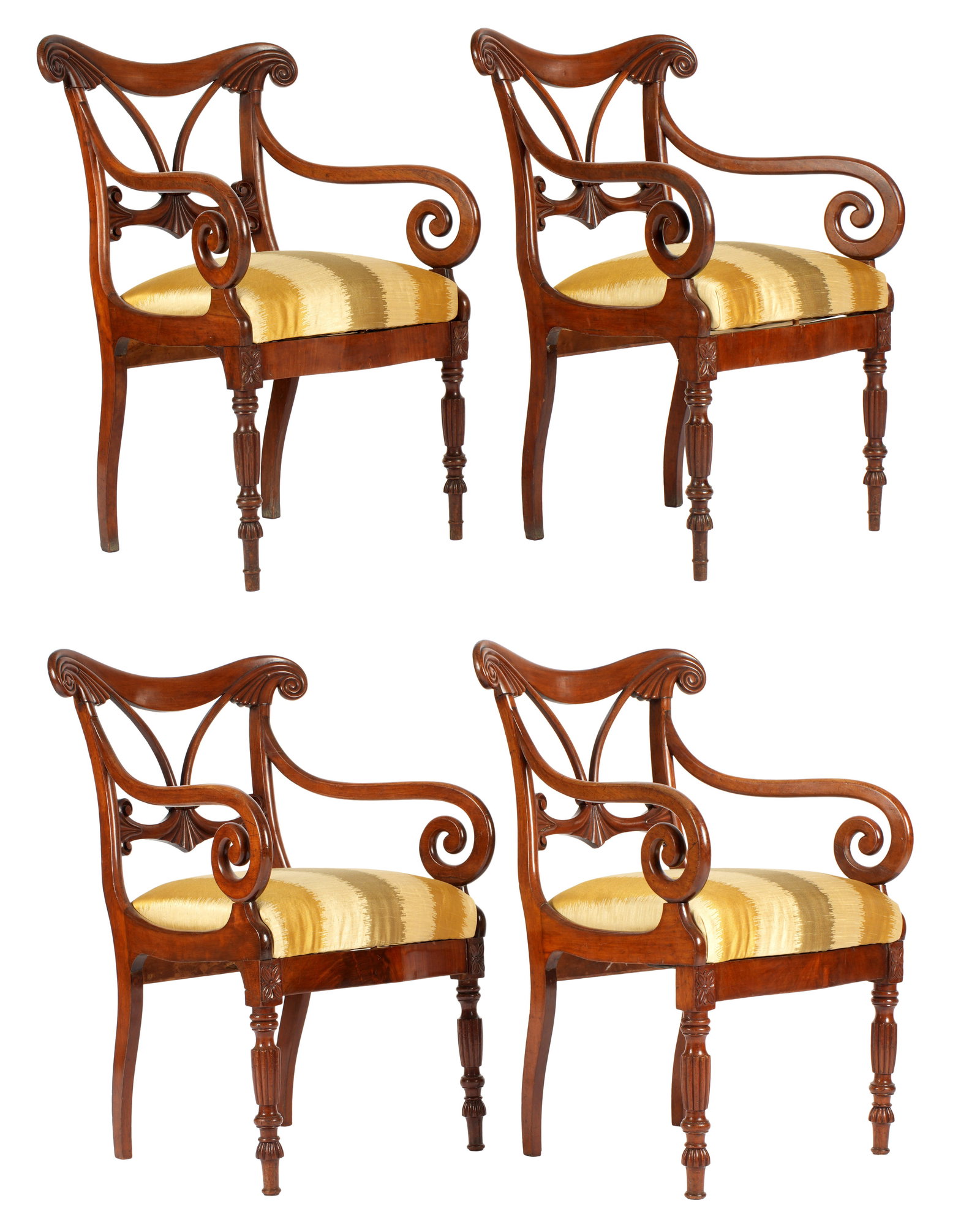 Set of Four William IV Carved Arm Chairs: Carved and shaped top rail over open work back splat. Shaped scroll arms, turned and fluted front legs. Patterned silk upholstery. Overall 37" h. x 22.5" x 23". Wear consistent with age and use.