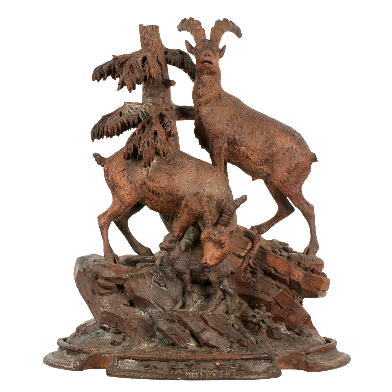 Johann Grossmann Black Forest Deer and Goat: 19th Century Black Forest carving of two stag deer and goat on rocky outcropping with tree. Impressed stamp J. Grossmann who is a well regarded carver from Interlaken, Switzerland mid 19th Century.