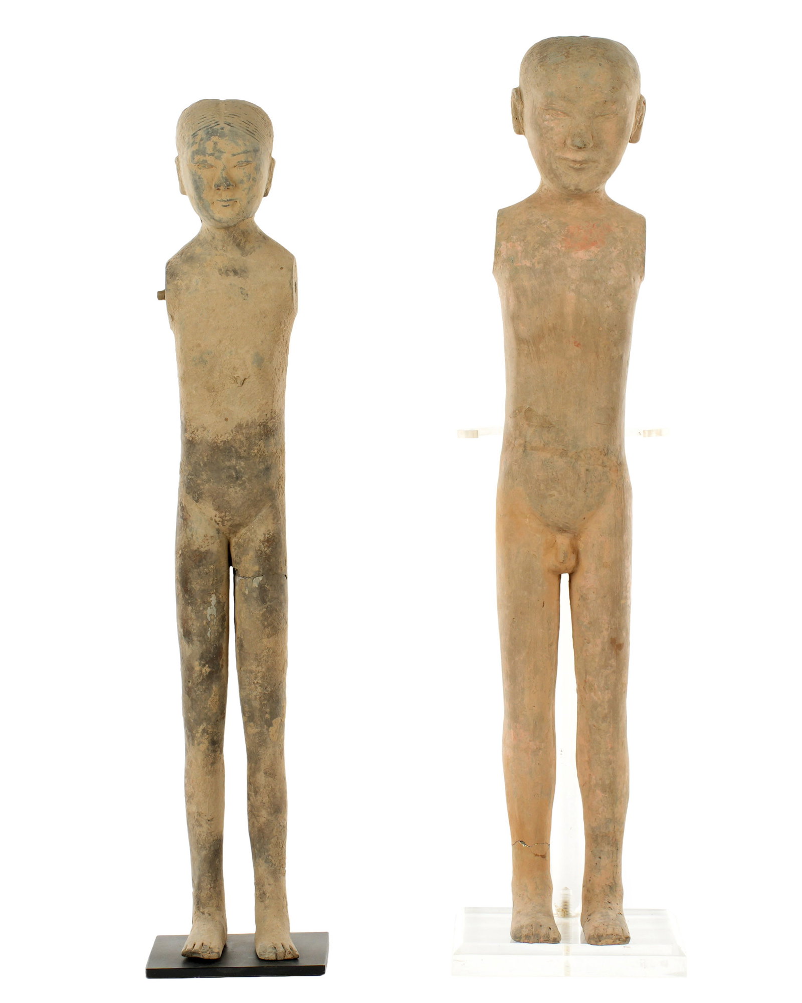 Pair Exhibited Chinese Han Tall Slender Figure: Chinese, Han Dynasty, 220 BC - 220 AD, pair terracotta / pottery mingqi slender tomb figures, very slight traces of paint remains, male measures 22.75" h., female 22" h.. Condition: Male with repair t