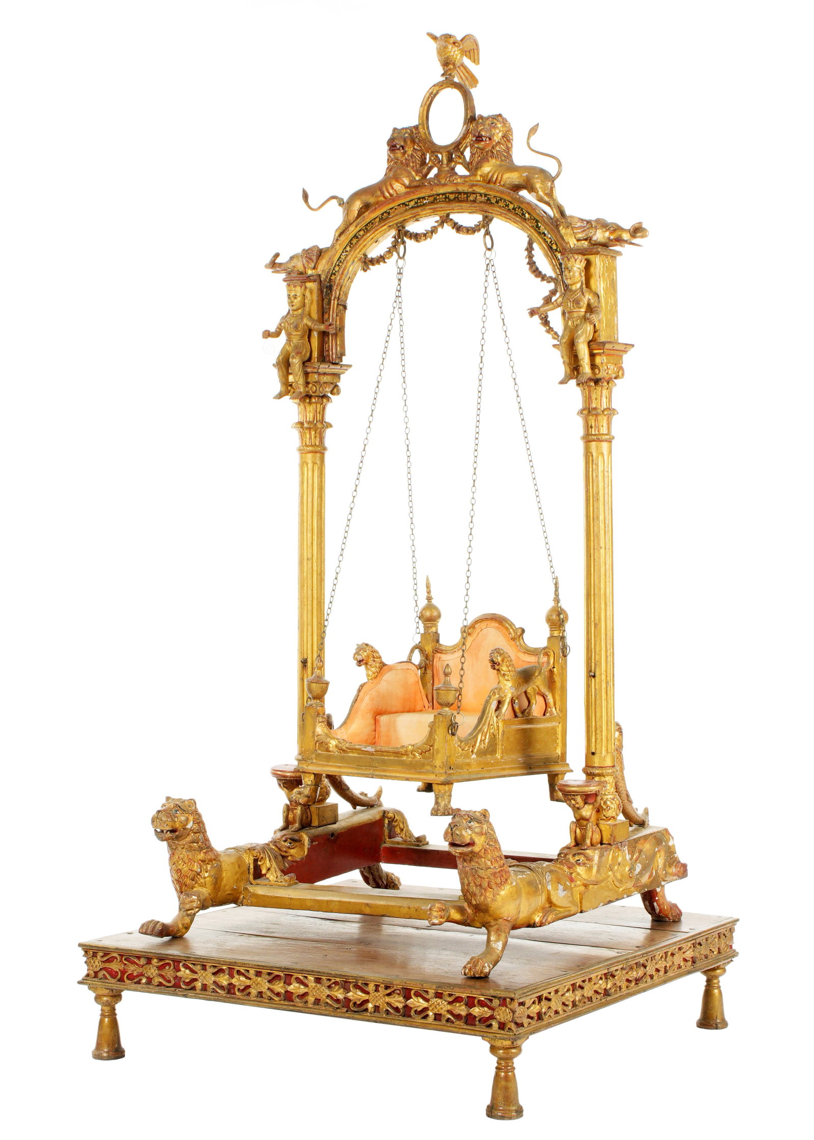 Large Carved Gilt Wood Indian Jhula Deity Swing: Carved gilt wood Jhula or Deity swing for a child. Arched crest, center eagle finial over open oval frame, flanked on either side with figural lions and elephant busts. Figural seated attendants over 