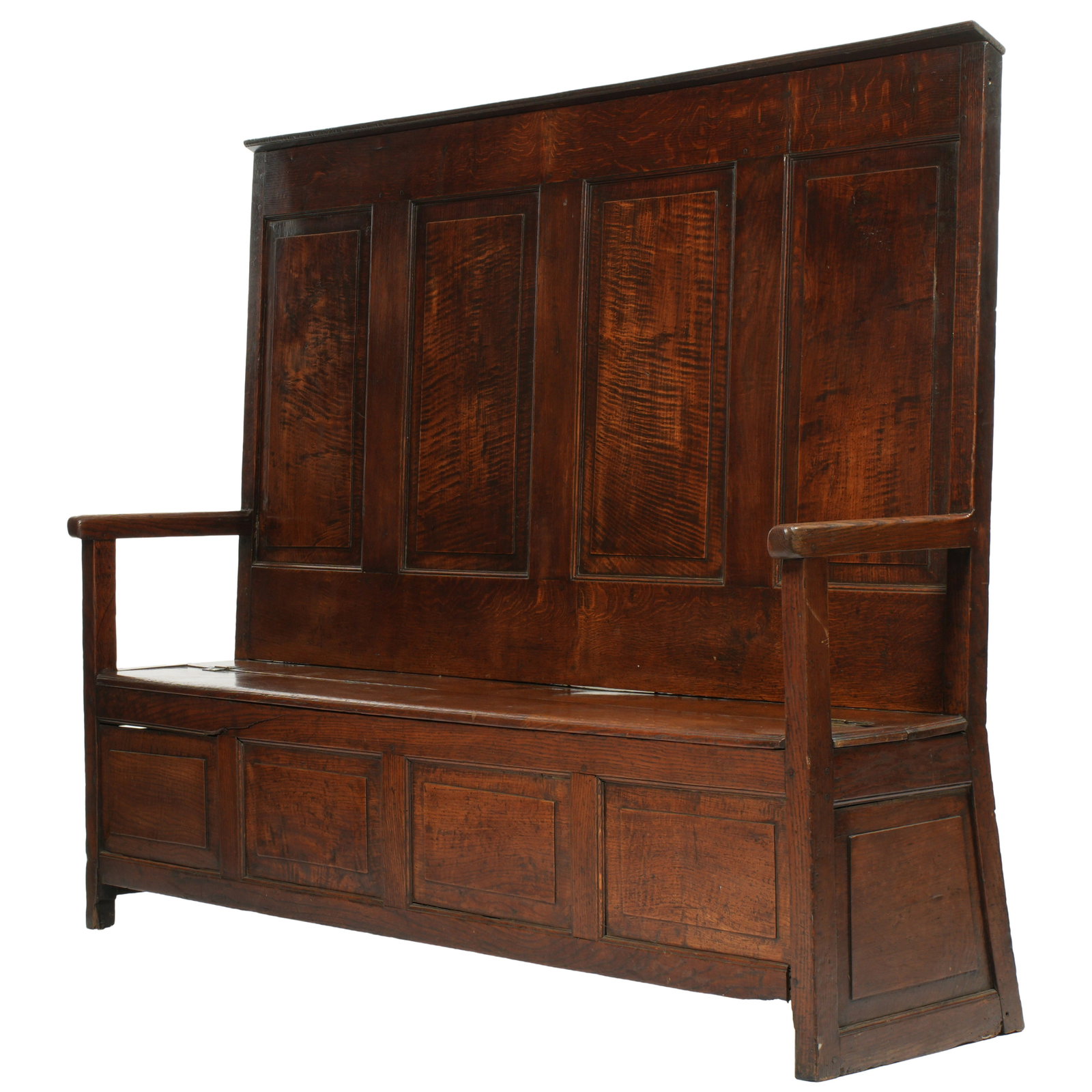 Antique English Oak Paneled Back Settle Bench: 18th / 19th Century, slightly canted four panel high back, straight arms and supports, half width hinged lid top seat opens to open storage, all on four legs. Overall 57.5"h. x 70.5" x 19". Condition:
