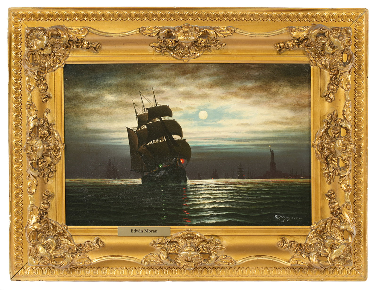 Edward Moran Ship in Moonlit New York Harbor: MORAN, Edward, (British, 1829-1901): Ship in Moonlit New York Harbor", with Statue of Liberty in background, Oil on Canvas, signed lower right, 12" x 18", framed 19.5" x 25.5". Condition Craquelure, s