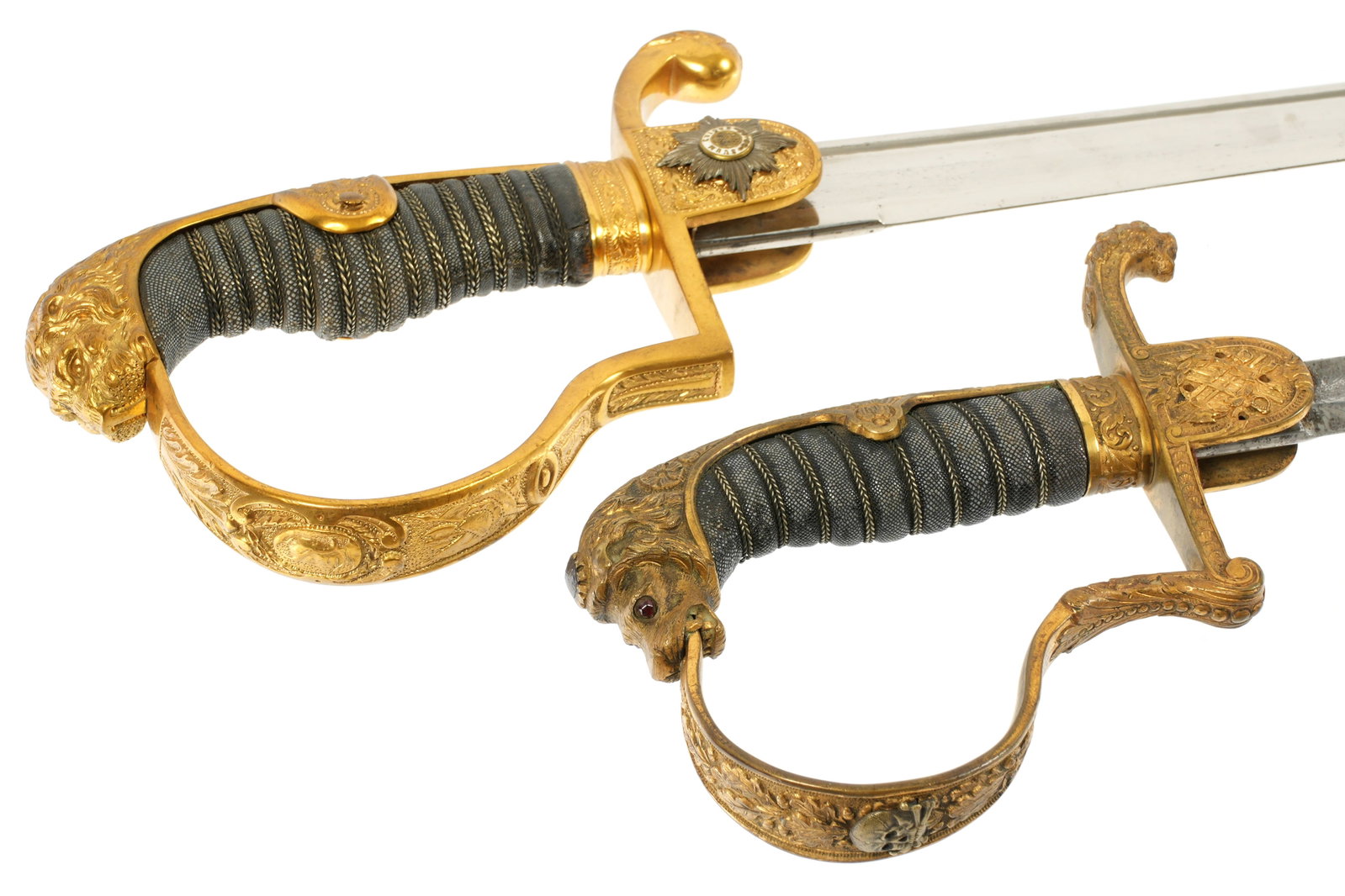 2 Prussian Imperial German Hussar Officers Swords: Two pieces total to include 1) Heavy gilt brass jawless lion head hilt, Guarde du Corps emblem on langet, shagreen grip. Large 33.5" minty W. K. & C. "Grosser" blade. Japanned black steel scabbard, ov